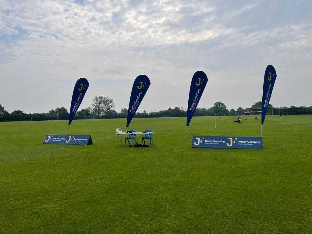 Ram Rugby high-visibility custom foam corner flags in bright colors, designed as durable advertising wedges for rugby fields