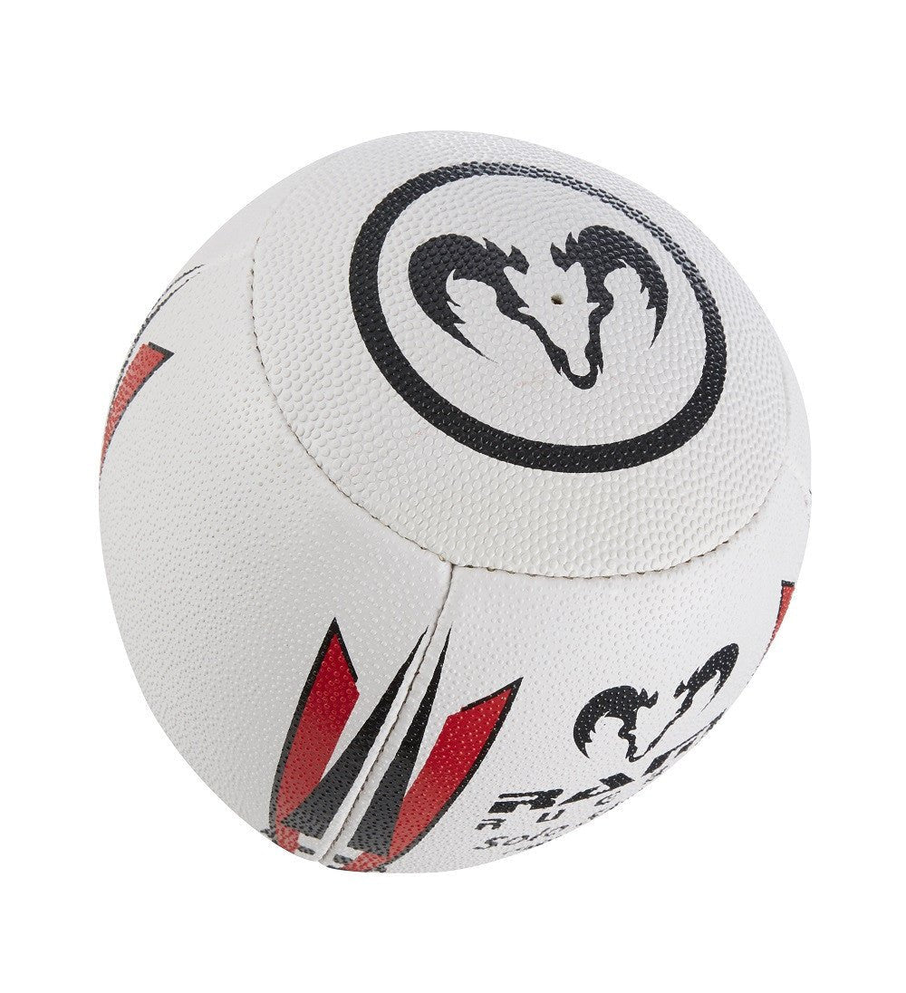 Ram Rugby Solo Skills Ball shown spinning mid-air with flat edge for passing practice and solo rugby training drills