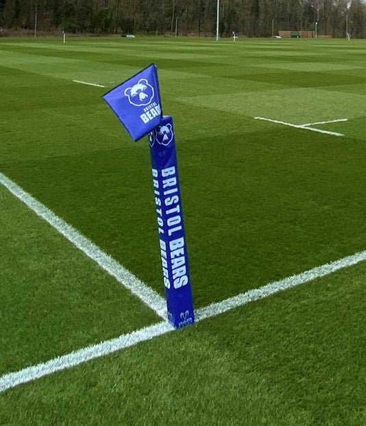 Ram Rugby custom foam pole protectors in bright red, designed for rugby goal posts to reduce impact near goal lines